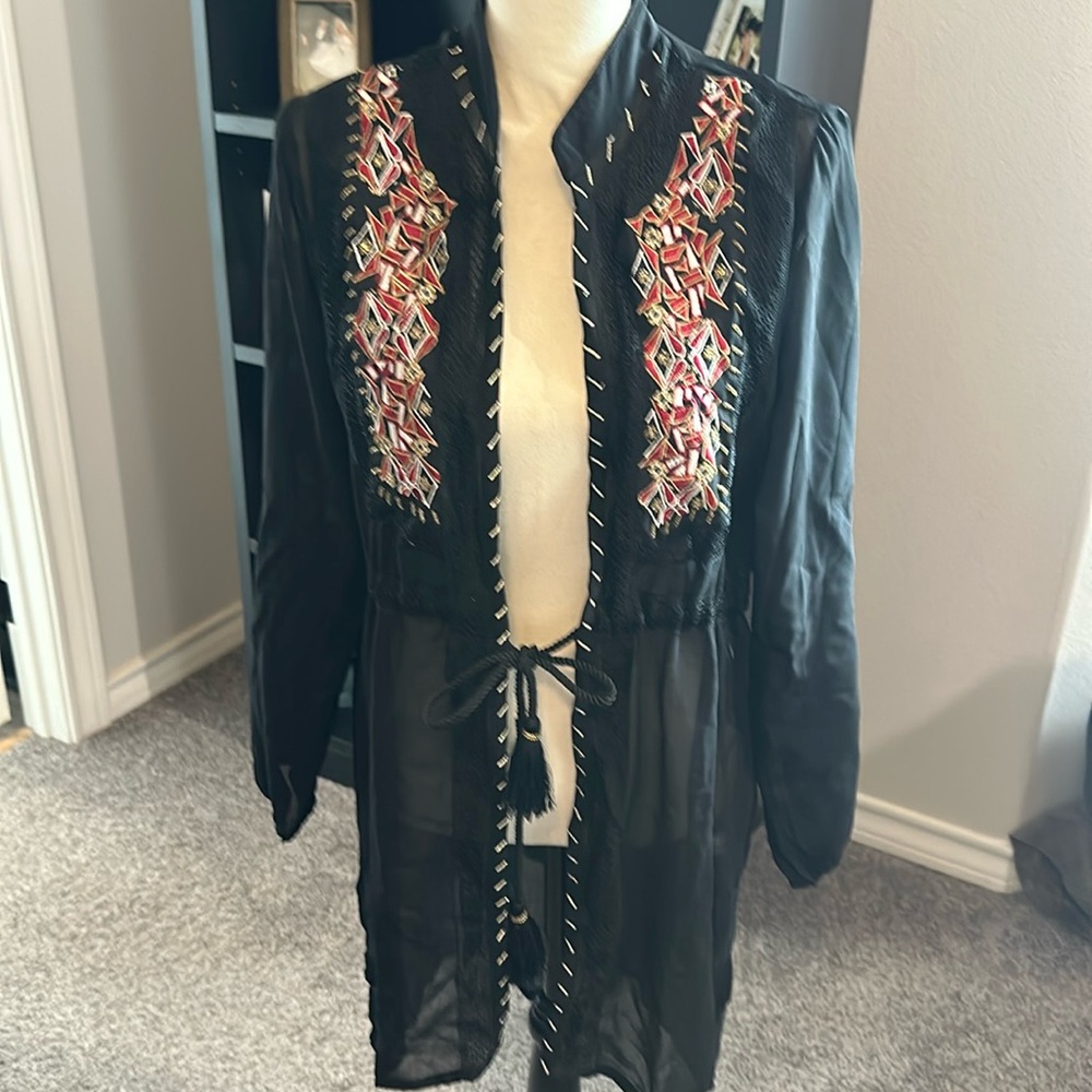 Lightweight overcoat with beautiful red & gold brocade. Partly sheer fabric.